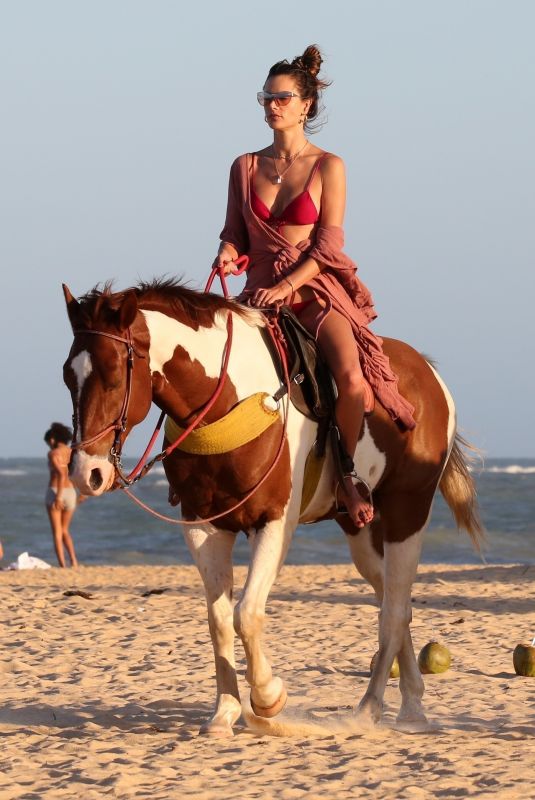 ALESSANDRA AMBROSIO in a Red Bikini Riding a Horse at a Beach in Trancoso 08/05/2021