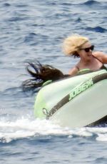 CHARLIZE THERON in a Black Swimsuit at a Yacht in Greece 08/08/2021