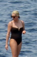 CHARLIZE THERON in a Black Swimsuit at a Yacht in Greece 08/08/2021