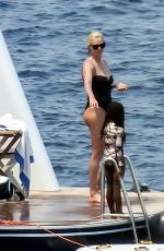 CHARLIZE THERON in a Black Swimsuit at a Yacht in Greece 08/08/2021