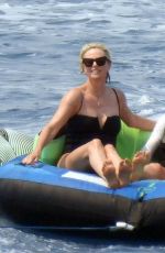 CHARLIZE THERON in a Black Swimsuit at a Yacht in Greece 08/08/2021
