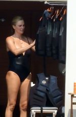 CHARLIZE THERON in a Black Swimsuit at a Yacht in Greece 08/08/2021