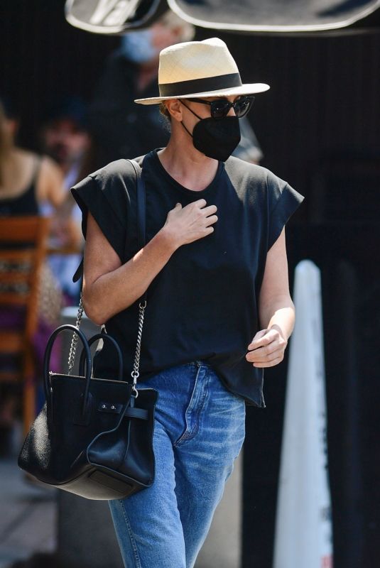 CHARLIZE THERON in Denim Out for Lunch in Los Angeles 08/24/2021