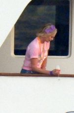 CHARLIZE THERON Poseing at a Yacht on Her 46th Birthday in Mykonos 08/07/2021