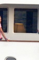 CHARLIZE THERON Poseing at a Yacht on Her 46th Birthday in Mykonos 08/07/2021