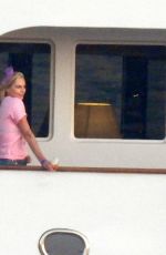 CHARLIZE THERON Poseing at a Yacht on Her 46th Birthday in Mykonos 08/07/2021
