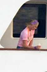 CHARLIZE THERON Poseing at a Yacht on Her 46th Birthday in Mykonos 08/07/2021