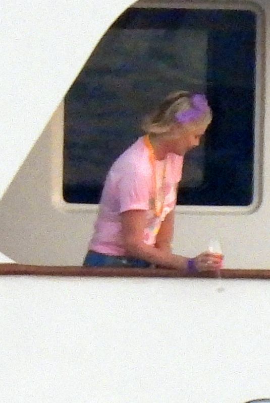 CHARLIZE THERON Poseing at a Yacht on Her 46th Birthday in Mykonos 08/07/2021