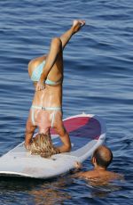 CHRISTINE QUINN in Bikini Practicing Yoga on a Board in Taormina 08/07/2021