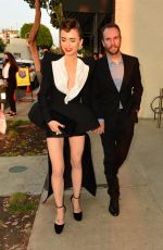 LILY COLLINS and Charlie McDowell at Cartier