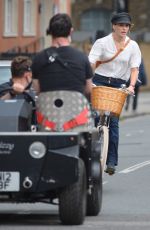 MELIA KREILING Riding a Bike on the Set of Mammals in London 08/03/2021