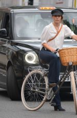 MELIA KREILING Riding a Bike on the Set of Mammals in London 08/03/2021
