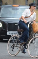 MELIA KREILING Riding a Bike on the Set of Mammals in London 08/03/2021