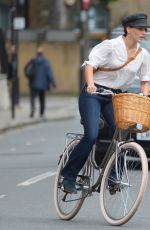 MELIA KREILING Riding a Bike on the Set of Mammals in London 08/03/2021