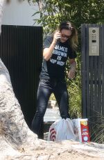 OLIVIA WILDE Taking at Order from Target Outside Her Home in Los Angeles 08/11/2021