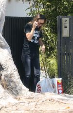 OLIVIA WILDE Taking at Order from Target Outside Her Home in Los Angeles 08/11/2021