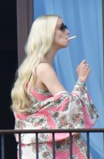 ANYA TAYLOR-JOY Enjoys a Cigarette on Her Hotel Balcony in Venice 09/04/2021