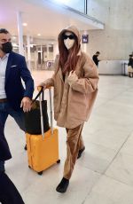 GIGI HADID Arrives at Charles de Gaulle Airport in Paris 09/27/2021