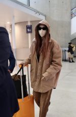 GIGI HADID Arrives at Charles de Gaulle Airport in Paris 09/27/2021