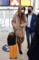 GIGI HADID Arrives at Charles de Gaulle Airport in Paris 09/27/2021