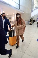 GIGI HADID Arrives at Charles de Gaulle Airport in Paris 09/27/2021