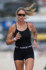CANDICE WARNER in Swimsuit Workout at a Beach in Sydney 10/28/2021