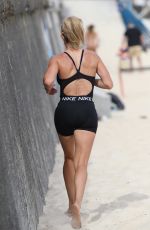 CANDICE WARNER in Swimsuit Workout at a Beach in Sydney 10/28/2021