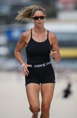 CANDICE WARNER in Swimsuit Workout at a Beach in Sydney 10/28/2021