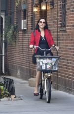 FAMKE JANSSEN Out Riding a Bike in New York 10/20/2021