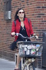 FAMKE JANSSEN Out Riding a Bike in New York 10/20/2021