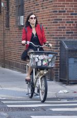 FAMKE JANSSEN Out Riding a Bike in New York 10/20/2021