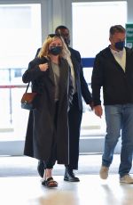 KIRSTEN DUNST and Her Agent Stephen Huvane at JFK Airport in New York 10/07/2021