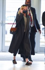 KIRSTEN DUNST and Her Agent Stephen Huvane at JFK Airport in New York 10/07/2021