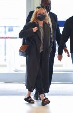 KIRSTEN DUNST and Her Agent Stephen Huvane at JFK Airport in New York 10/07/2021