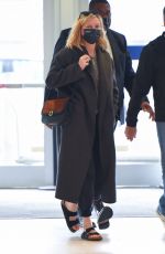 KIRSTEN DUNST and Her Agent Stephen Huvane at JFK Airport in New York 10/07/2021