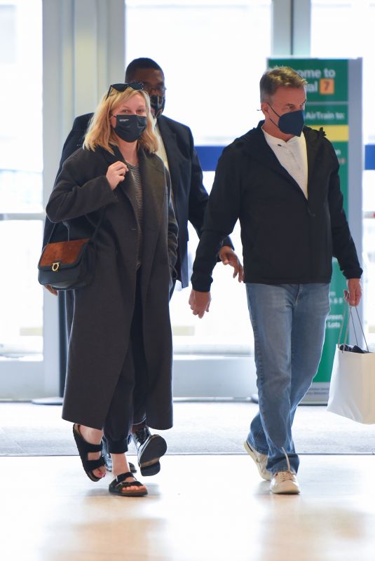 KIRSTEN DUNST and Her Agent Stephen Huvane at JFK Airport in New York 10/07/2021