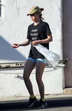 SUKI WATERHOUSE Cleans Out Her Car Out in Los Angeles 10/03/2021