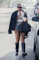 ADDISON RAE in Daisy Dukes at Joan