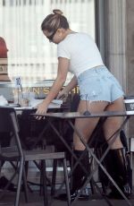 ADDISON RAE in Daisy Dukes at Joan