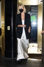 CHARLIZE THERON Leaves Her Hotel in New York 11/18/2021