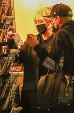 MILEY CYRUS Checks Herself on the Cover of a Magazine at a Newsstand in Los Angeles 11/13/2021