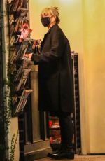 MILEY CYRUS Checks Herself on the Cover of a Magazine at a Newsstand in Los Angeles 11/13/2021