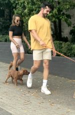 BROOKE BLURTON and Darvid Garayeli Out with Their Dogs in Melbourne 12/17/2021