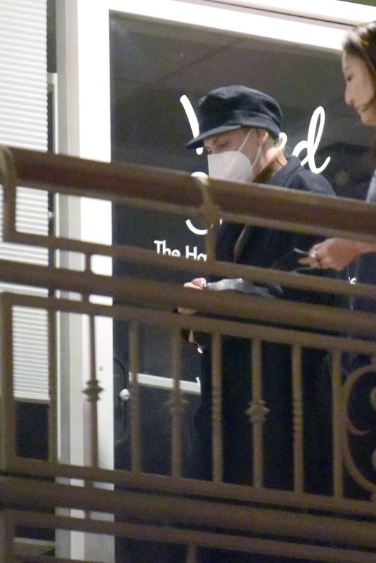 CHARLIZE THERON Leaves a Restaurant with Friends in Los Angeles 12/09/2021