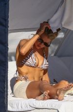 CHARLOTTE MCKINNEY in Bikini on the Beach in Miami 12/05/2021