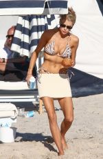 CHARLOTTE MCKINNEY in Bikini on the Beach in Miami 12/05/2021