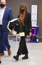 DAKOTA JOHNSON Arrives at JFK Airport in New York 12/04/2021