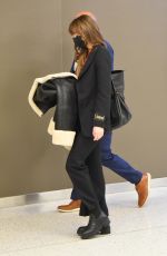 DAKOTA JOHNSON Arrives at JFK Airport in New York 12/04/2021