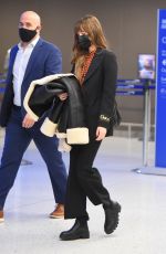 DAKOTA JOHNSON Arrives at JFK Airport in New York 12/04/2021