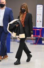 DAKOTA JOHNSON Arrives at JFK Airport in New York 12/04/2021